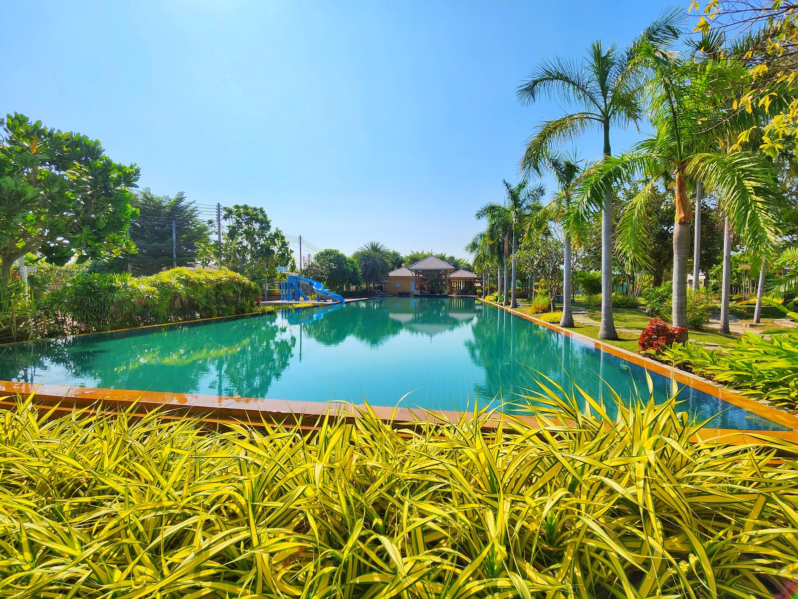 Large landscaped communal swimming pool at Casa Seaside Cha-Am